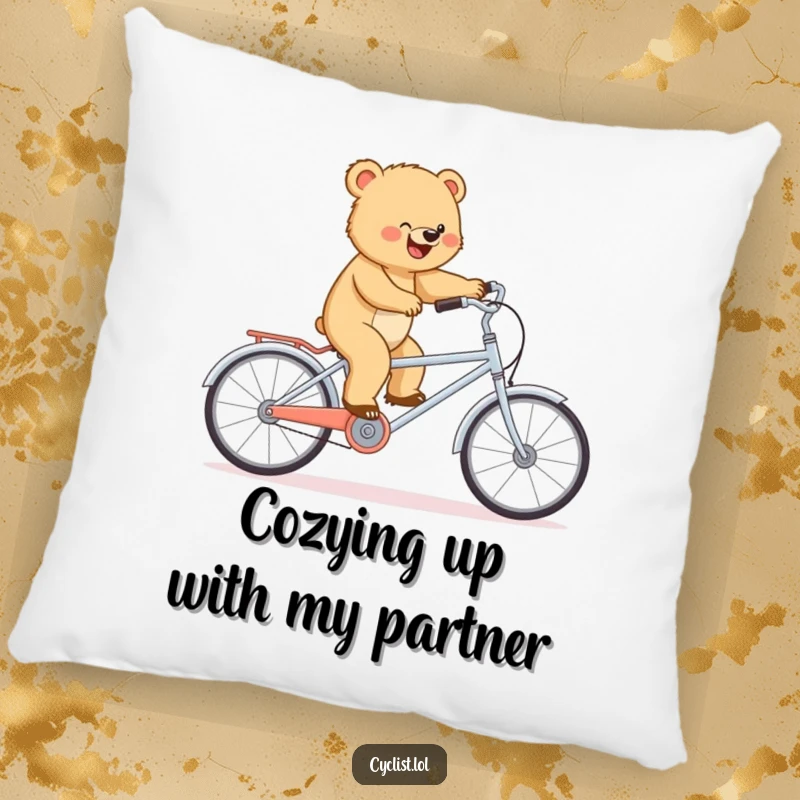 Funny pillow with a determined bear cub balancing on a miniature tandem bike, adding humorous comfort and charm.