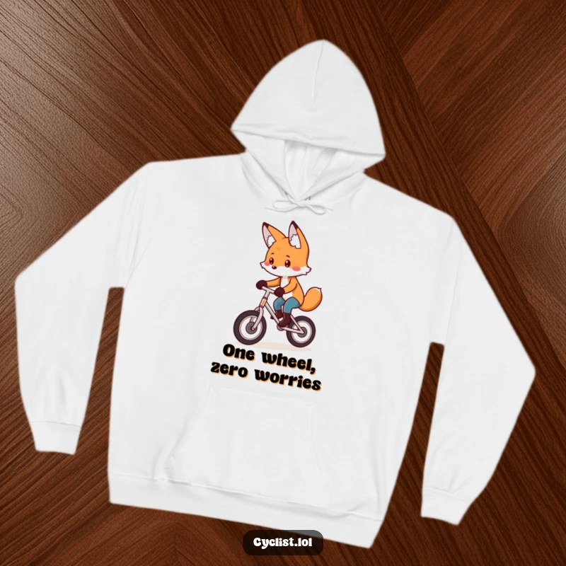 Funny hoodie with a playful fox meticulously pedaling a unicycle with intense concentration, perfect for cozy, focused wear.
